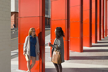 Students standing at entrance of BCU Curzon building