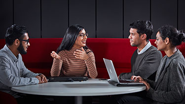Students working together around a table