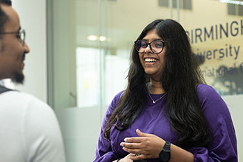 Female student chatting to friend at BCUIC college